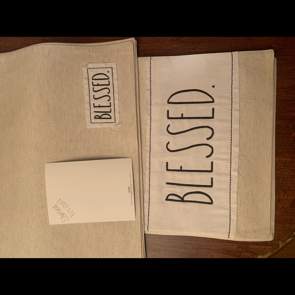 Rae dunn blessed table runner and four place settings.